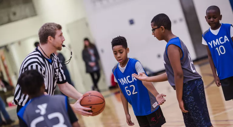 Jump Ball in Game at YMCA Youth Basketball League