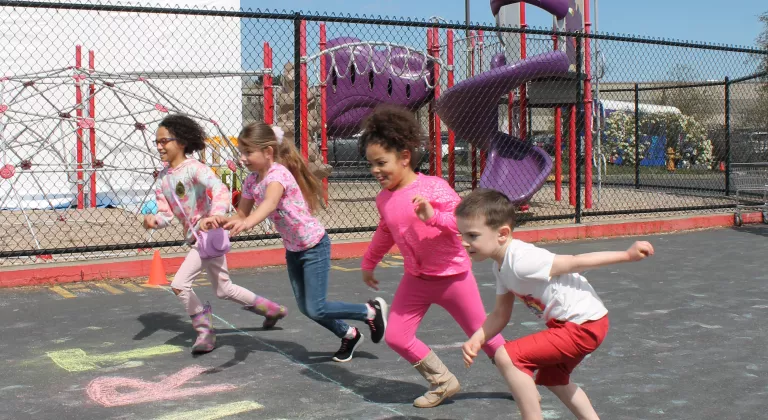 Action shot of Healthy Kids Day participants starting to run the fun run at the YMCA