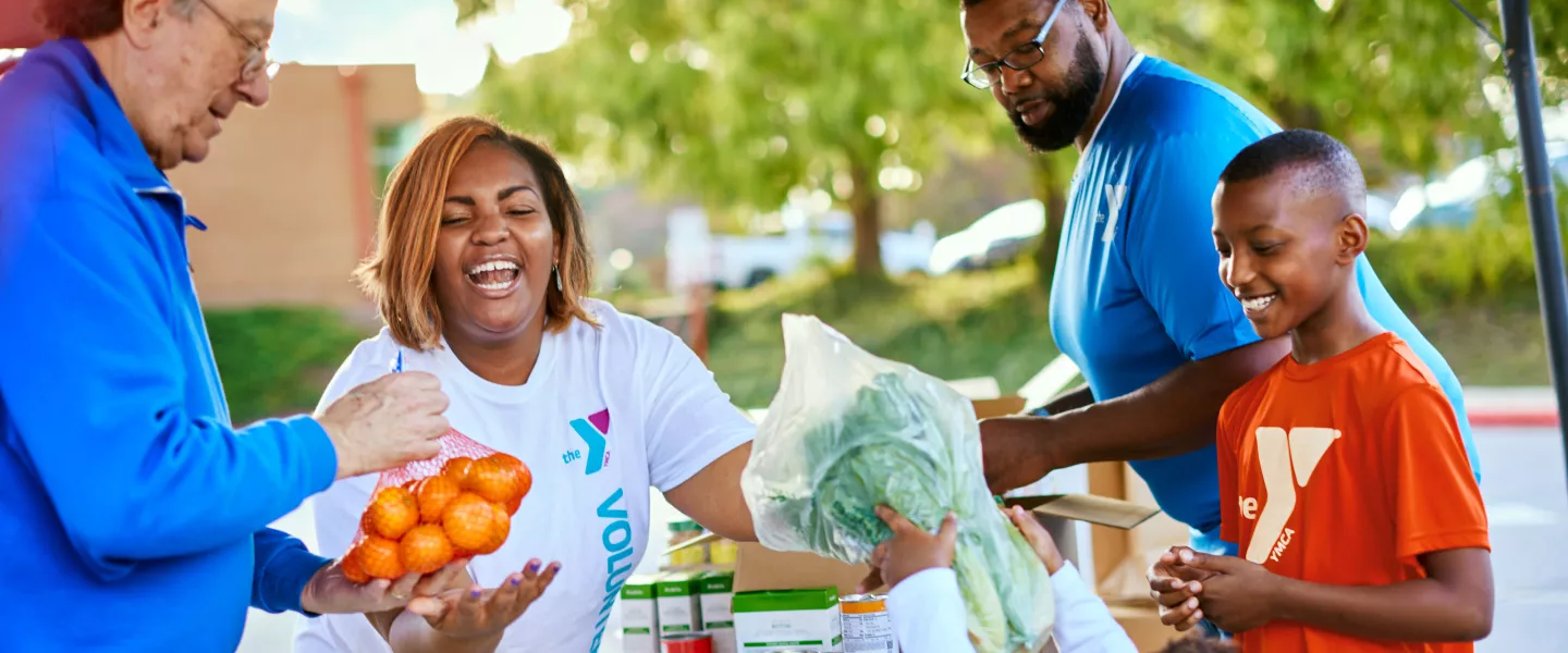 Giving Out Produce at YMCA Community Event