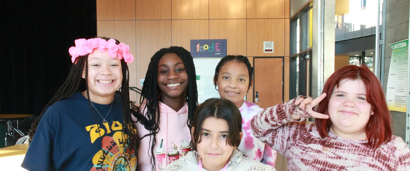 CCI students pose for a photo after school at the YMCA