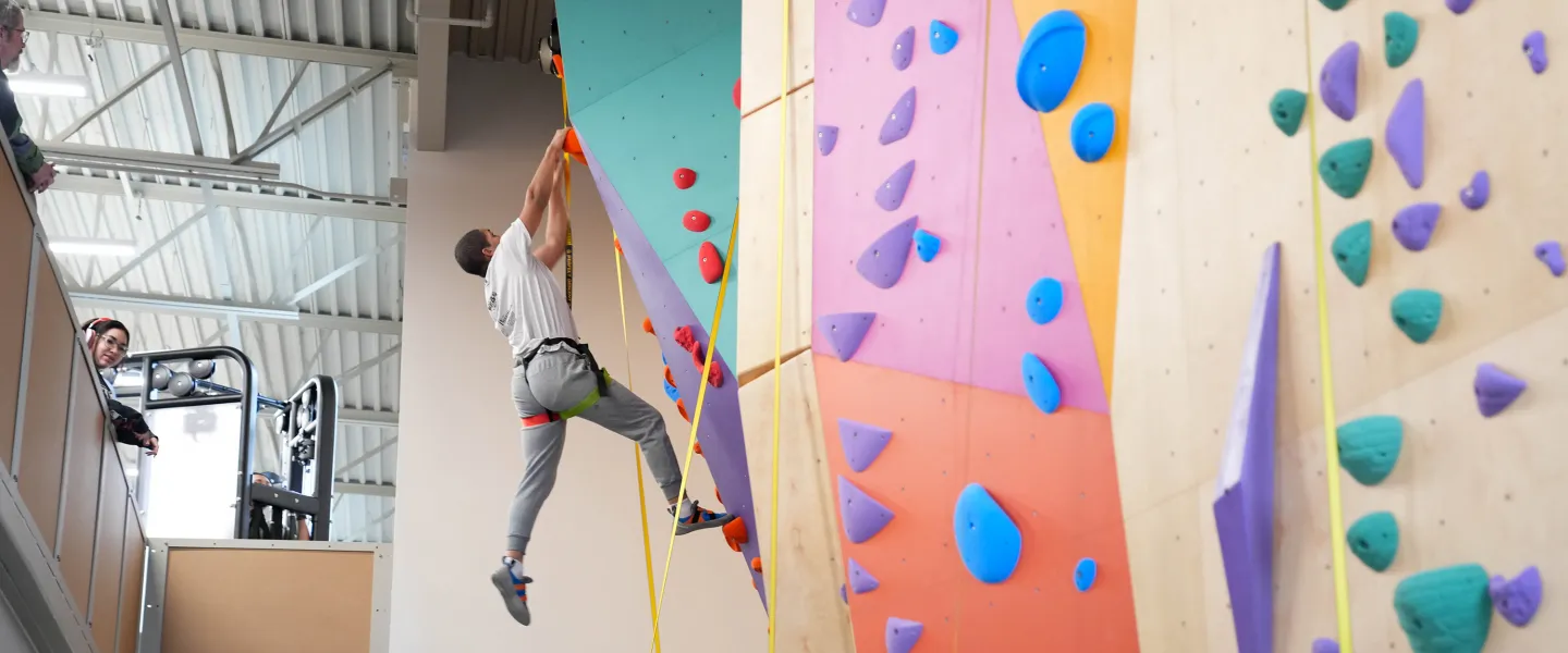 Climbing Up Pearl Street Rock Wall