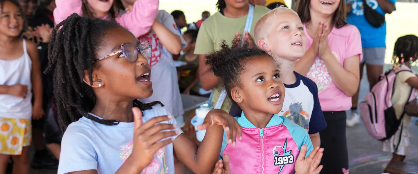 Clapping at YMCA Summer Day Camp Campfire Activity
