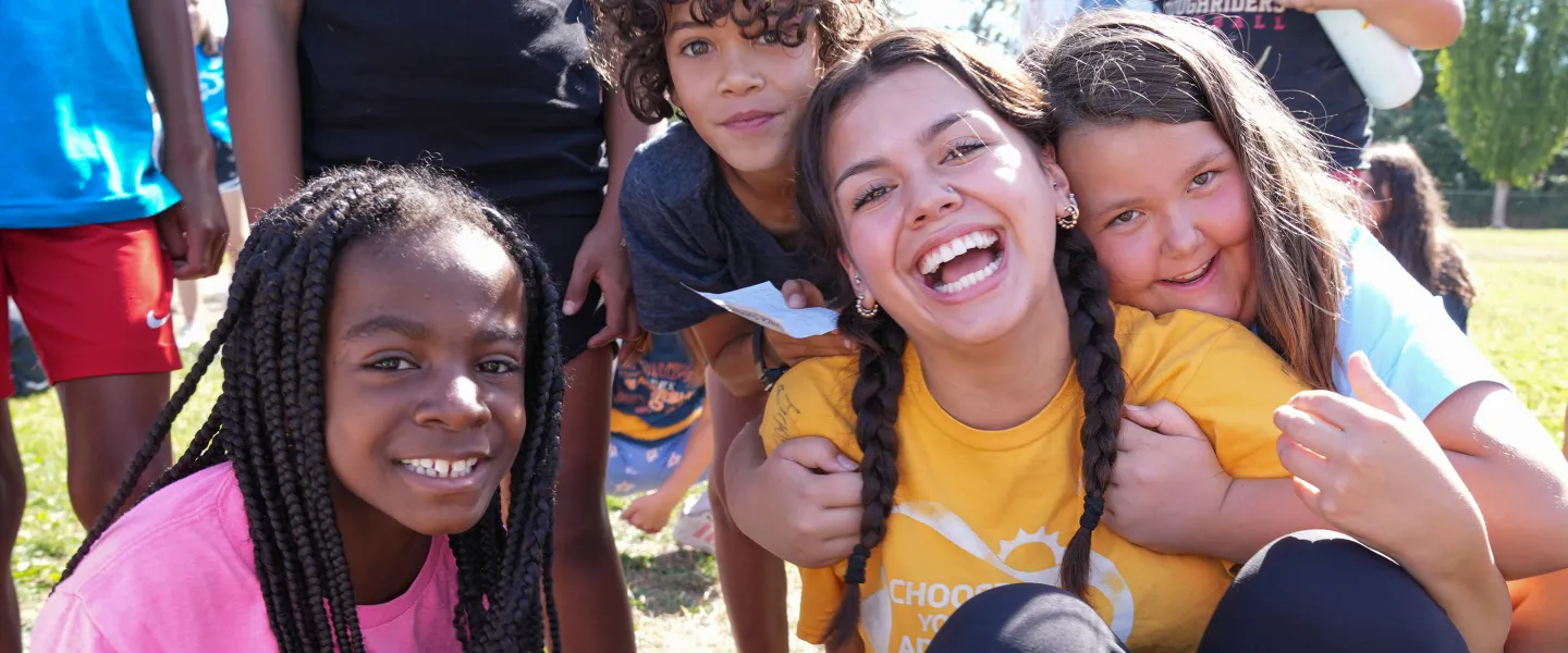 YMCA Summer Camp Counselor Posing with Campers