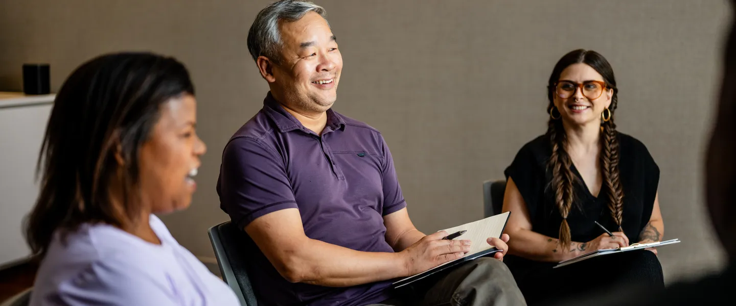 Man and Women Having Group Conversation at YMCA Community Center