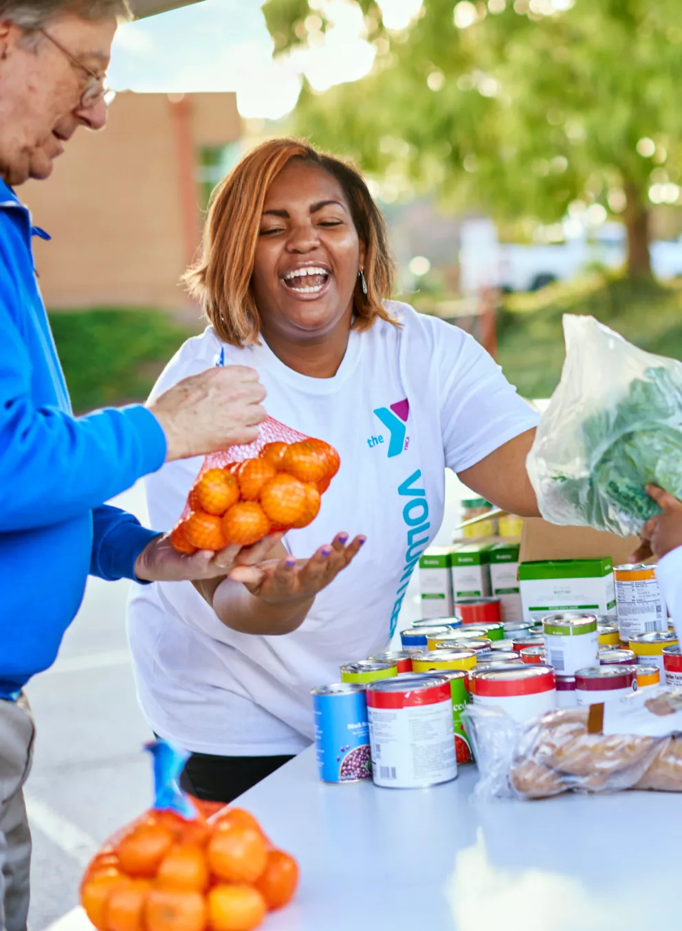 Giving Out Produce at YMCA Community Event