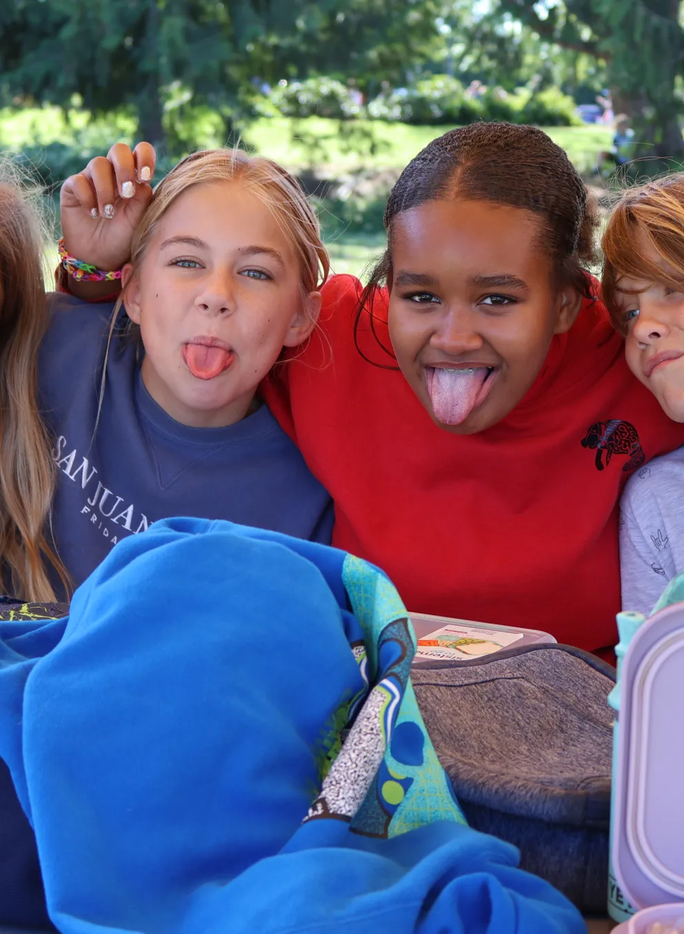 Campers pose for a picture during lunchtime at camp at the YMCA