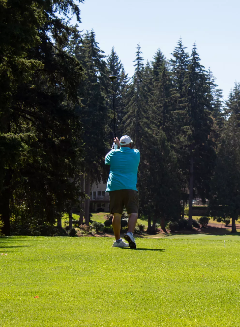 Action shot of a donor teeing off at the YMCA Annual Golf Tournament