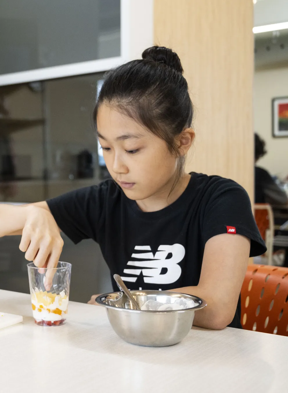 Culinary students assemble parfaits during class at the YMCA