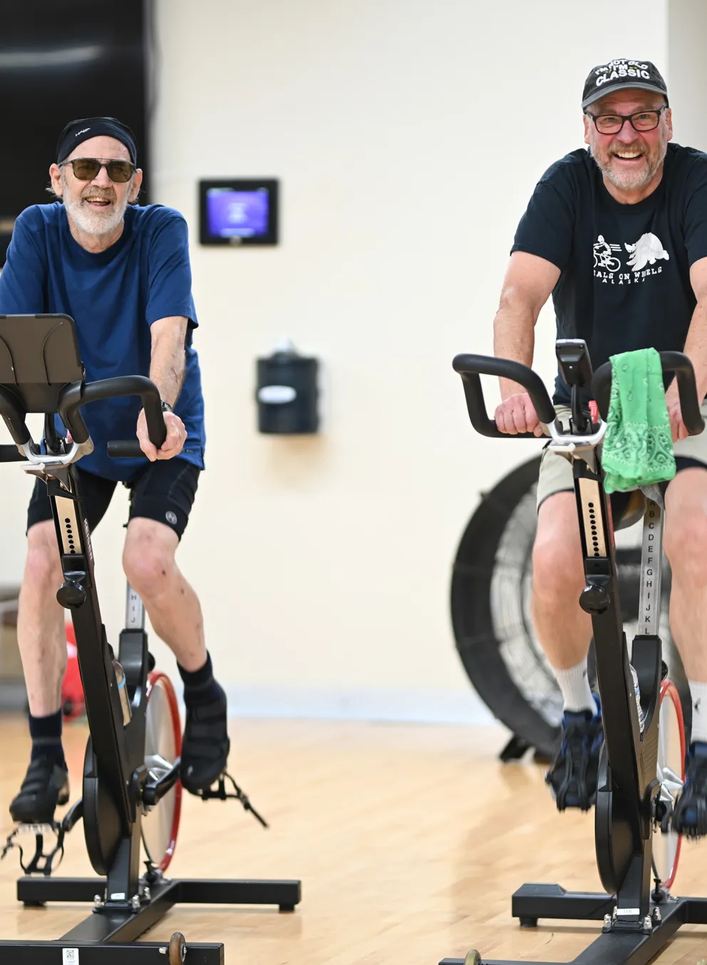 Two Friends Cycling in YMCA Spin Class