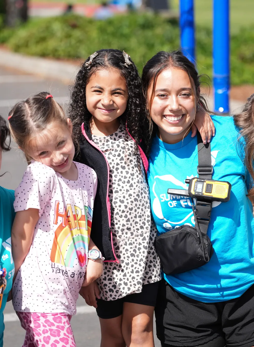 Two Conselors Smiling with Summer Campers at the Gordon Family YMCA