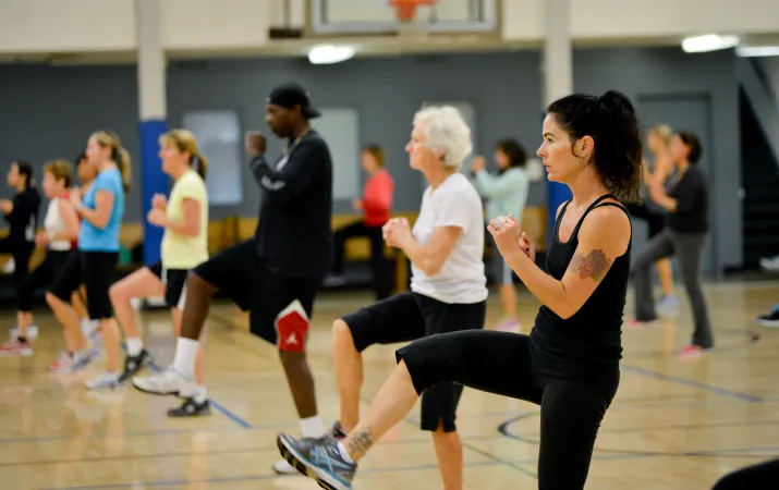 Action shot of a cardio class session at the Y on Pearl Street