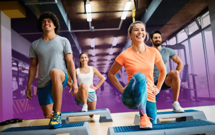 Action shot of a step aerobics class at the YMCA