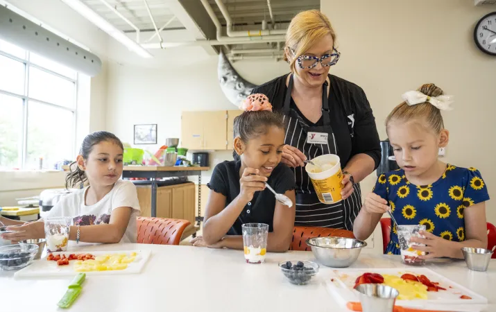 Shot of a youth culinary class learning how to make parfaits at the YMCA