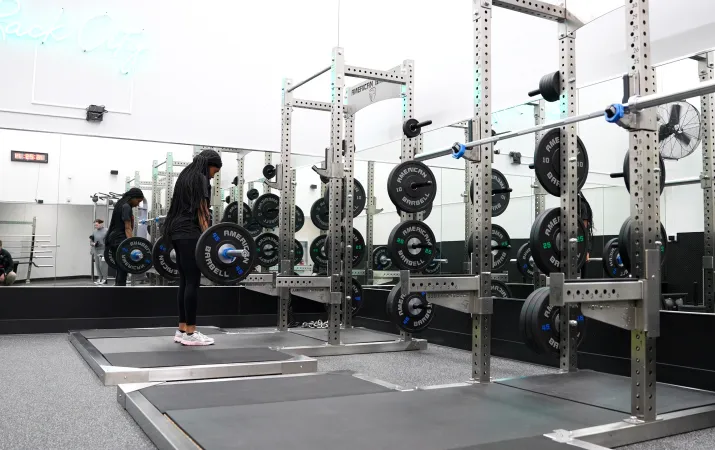 Tacoma Center Member Lifting Heavy Barbell