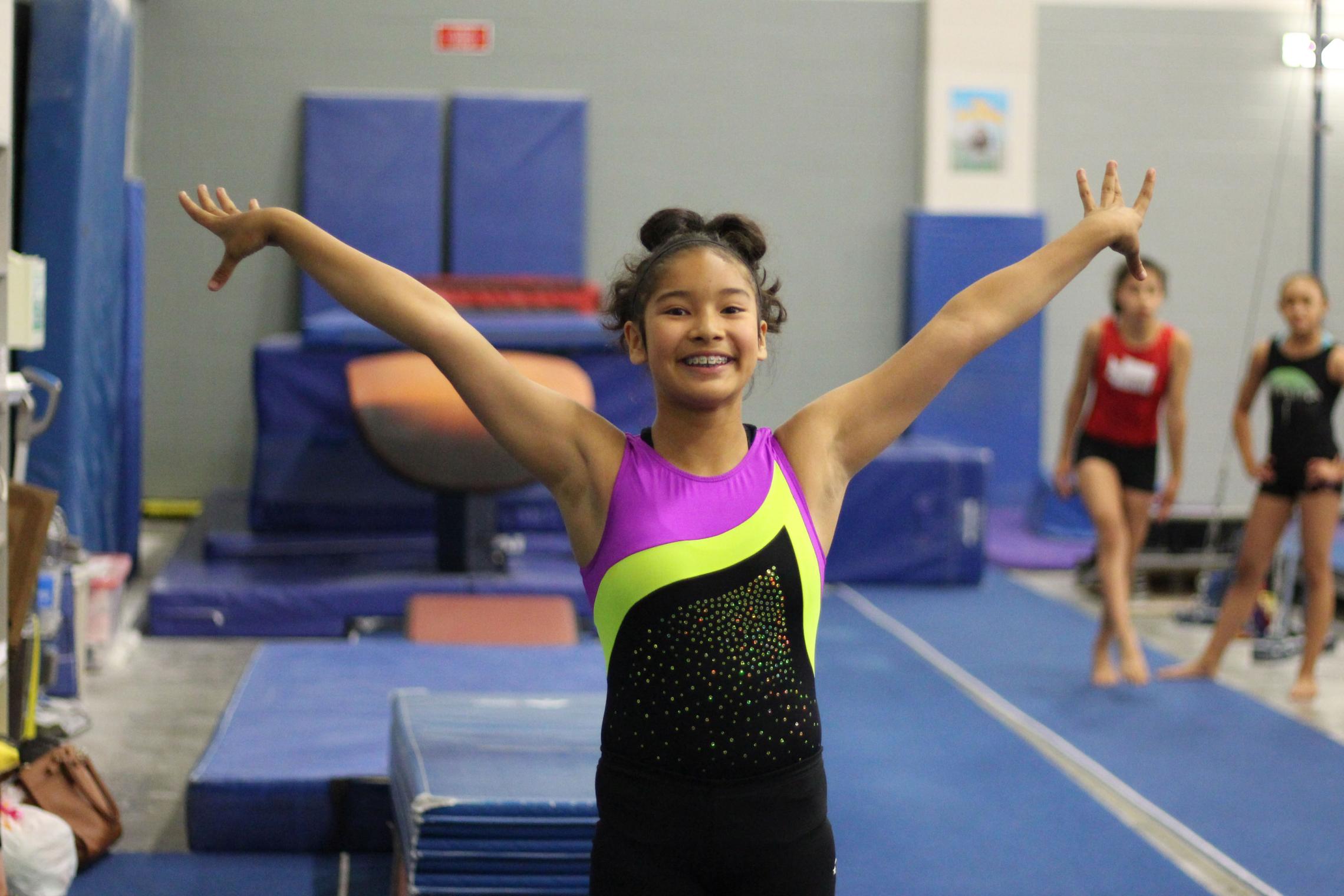 Smile and Pose in YMCA Gymnastics Class