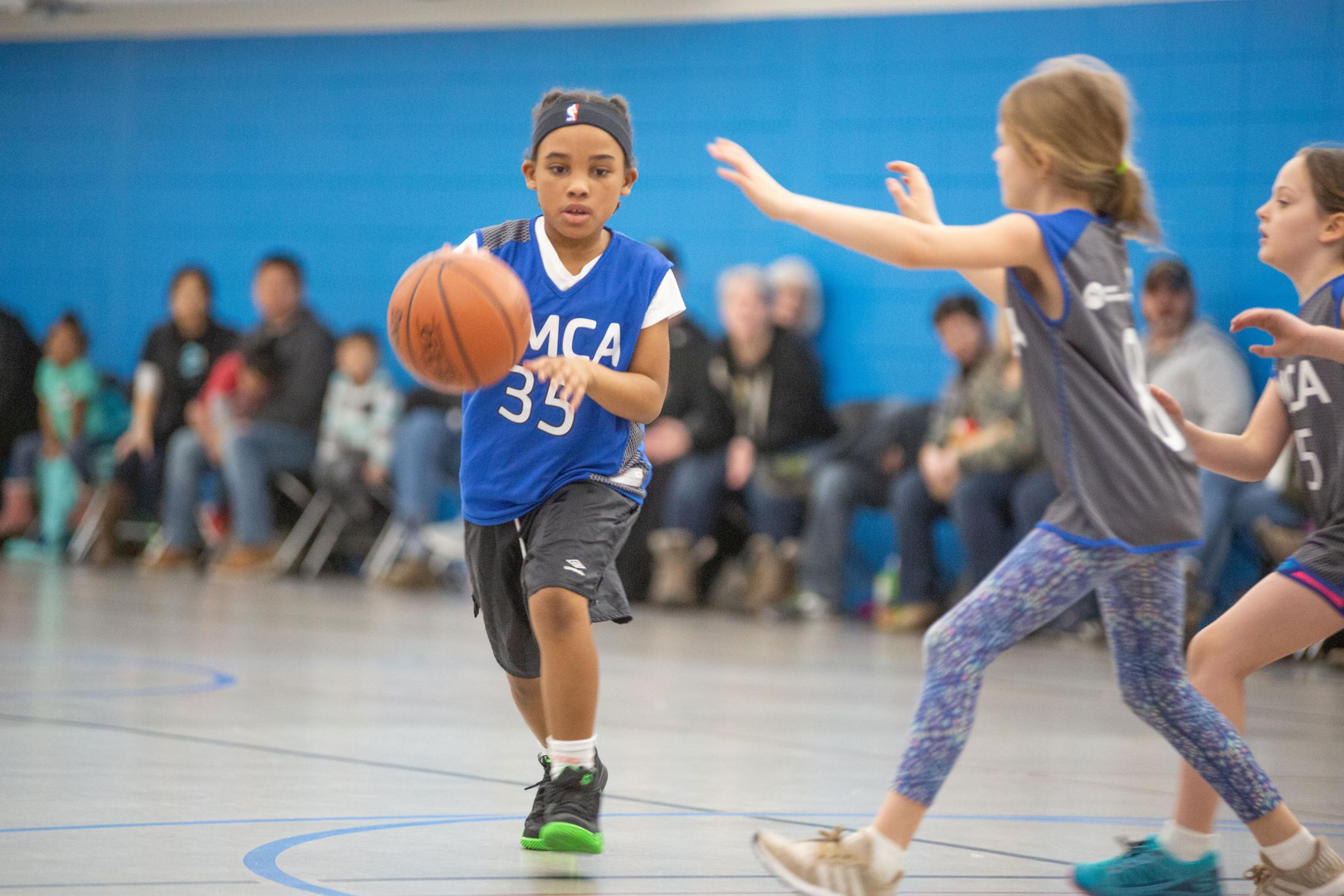 Driving Down the Court at YMCA Youth Basketball League