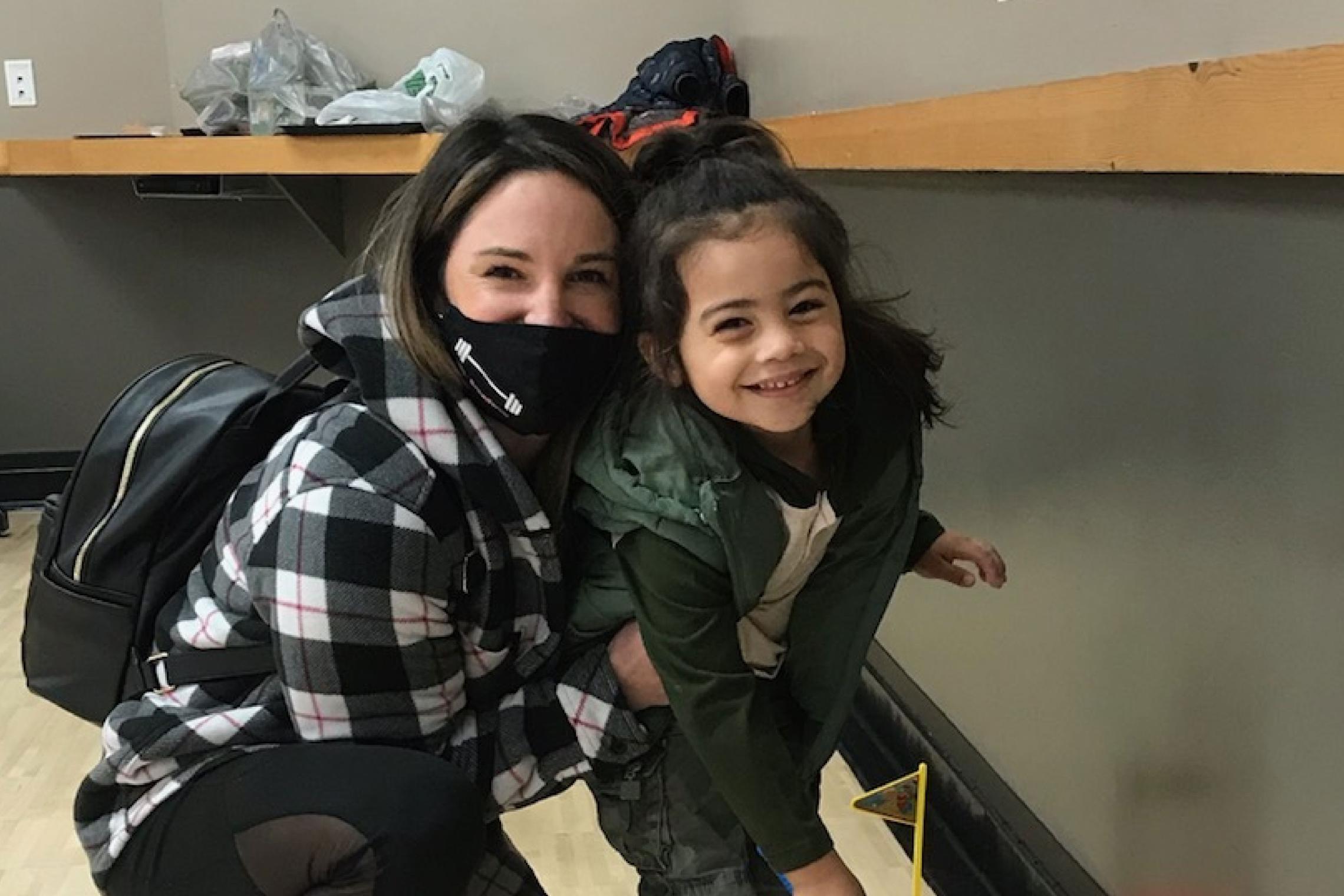 Mother Hugging Child At YMCA Early Learning Center