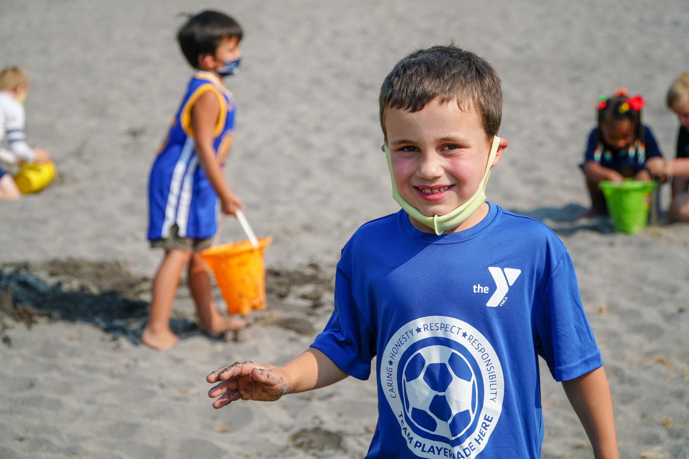 Kids Playing In The Sand At YMCA Summer Day Camp