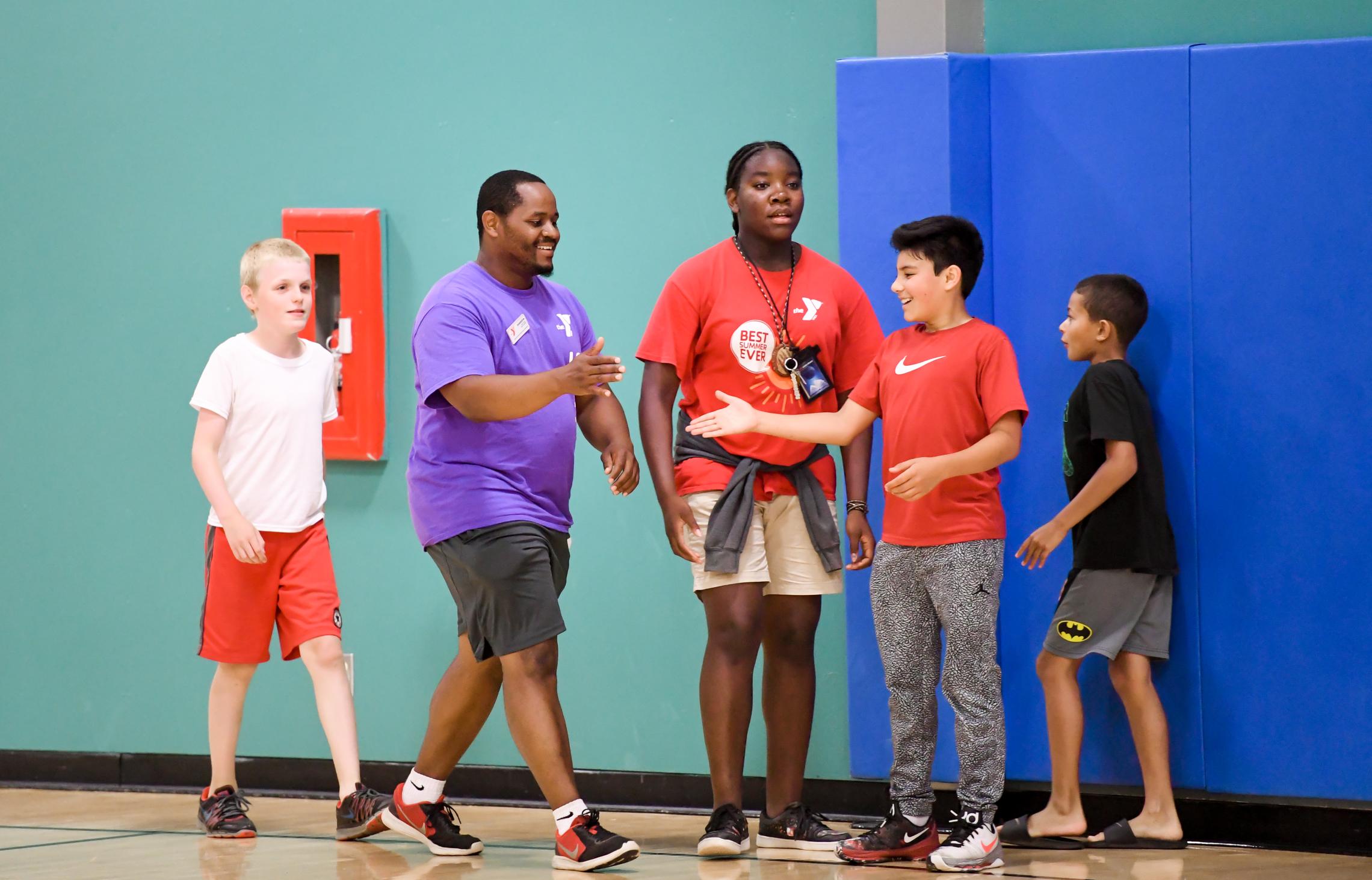 coach and youth member handshake