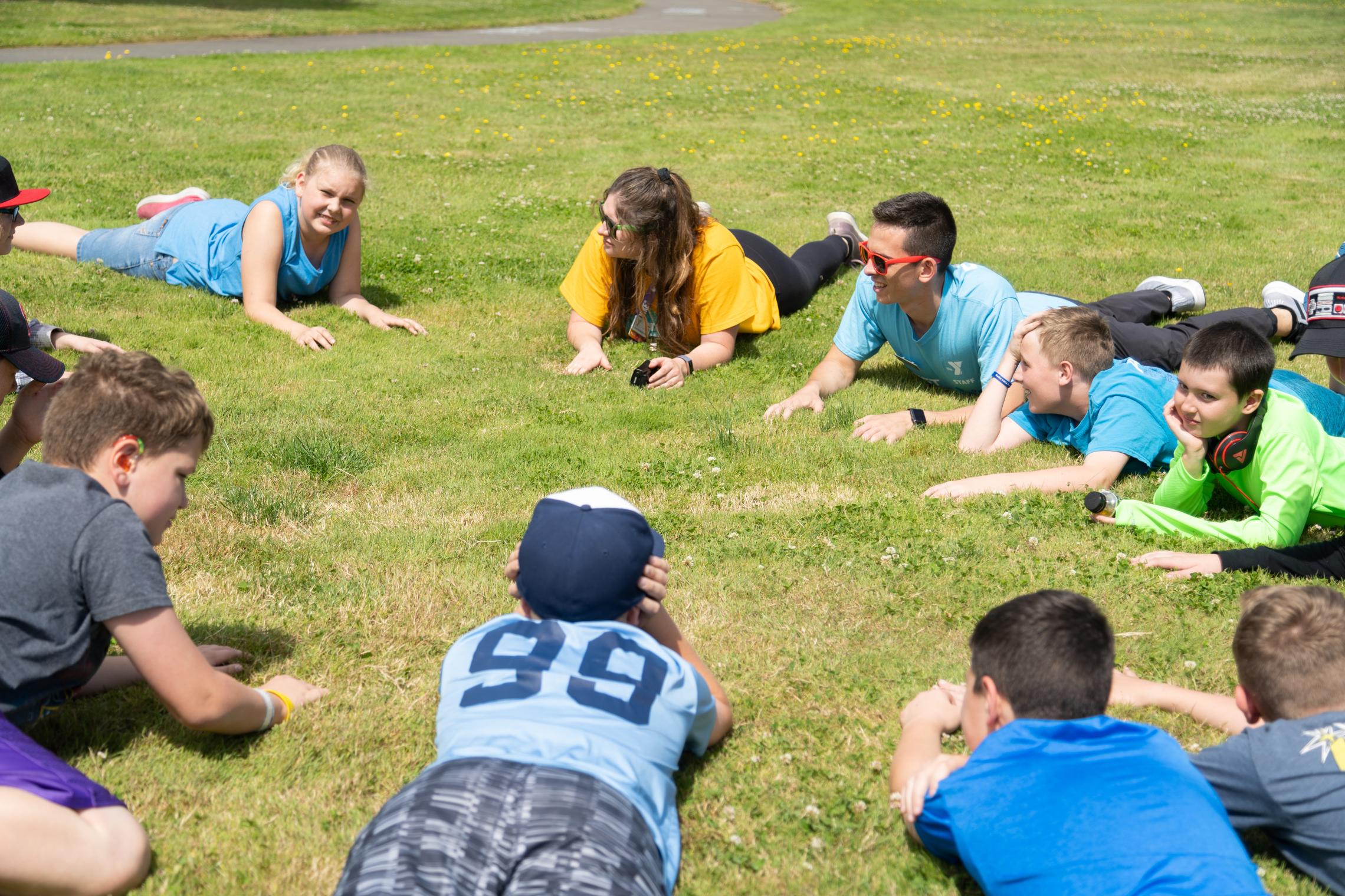 Group of summer program youth playing in a field