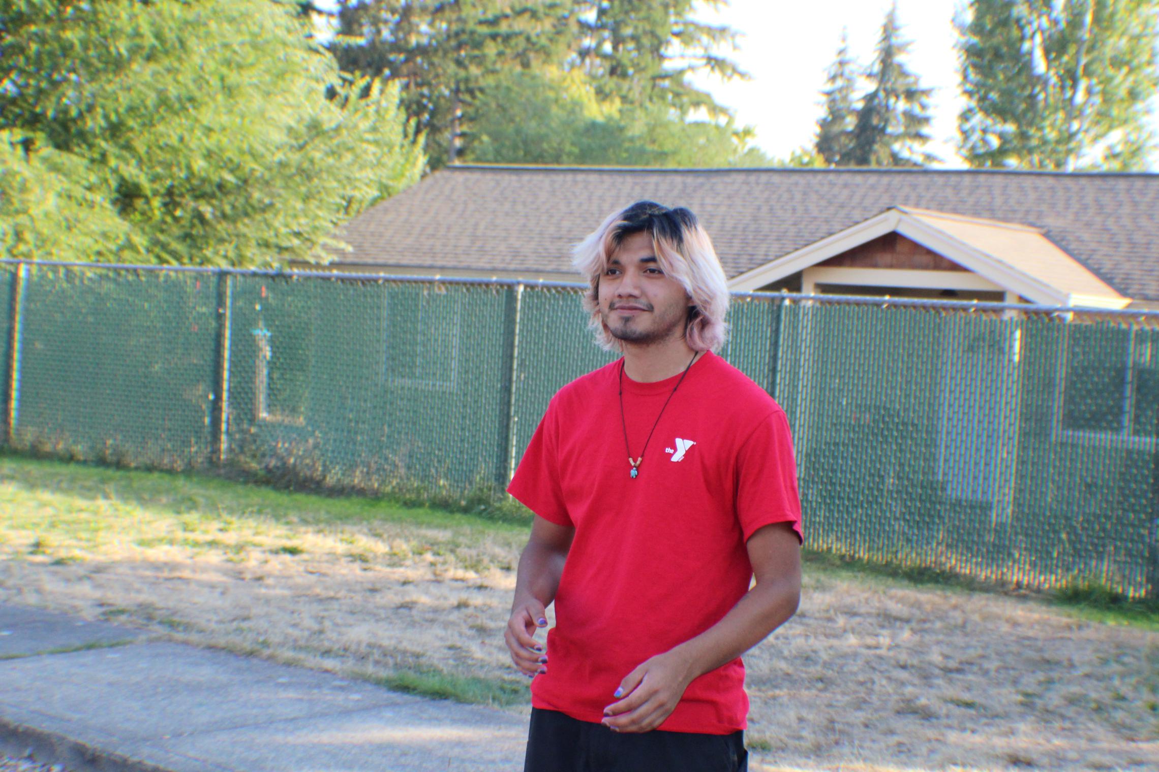   Nathaniel Tapia, also known as “Mr. Turtle” playing football with Crownhill participant  