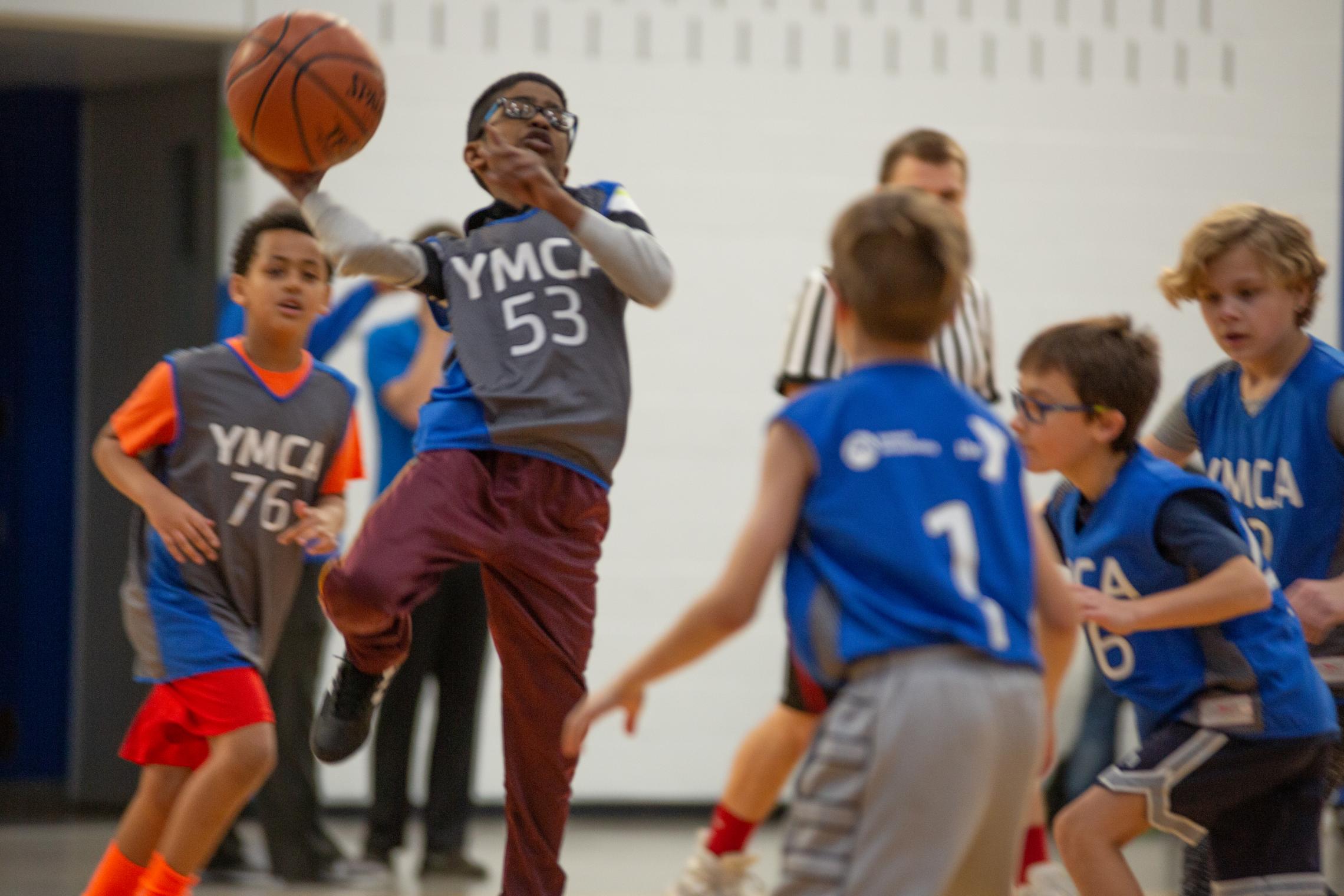 Action shot of heated youth basketball game