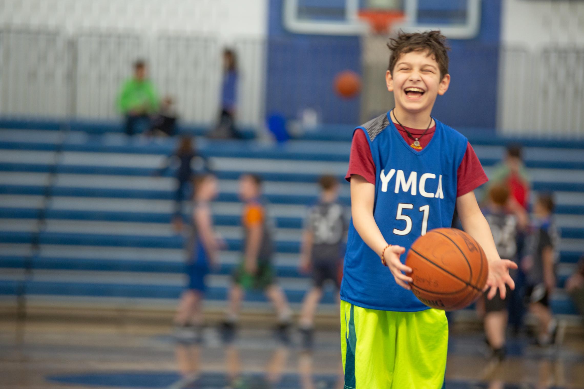 Youth basketball player laughing