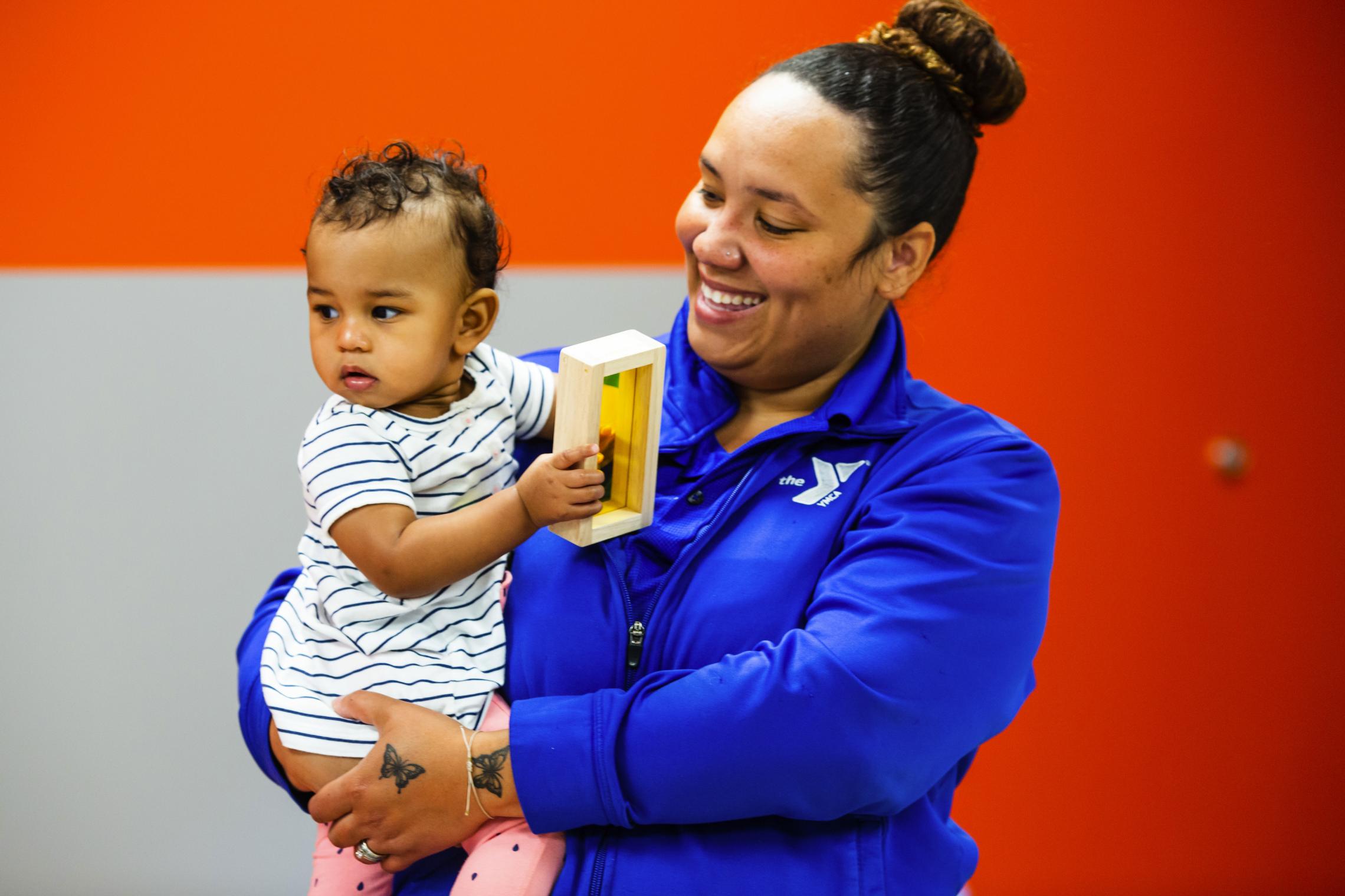 A teacher and baby at the YMCA Early Learning Center