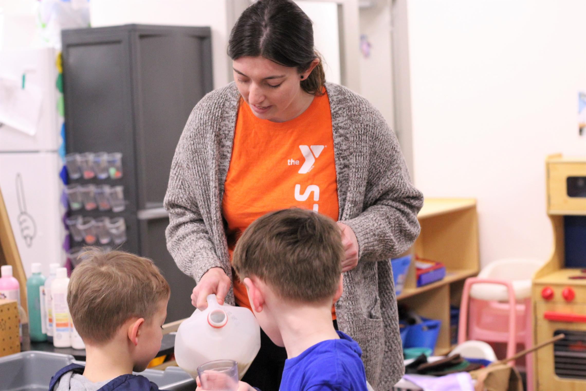 Autumn pouring a glass of milk for students 