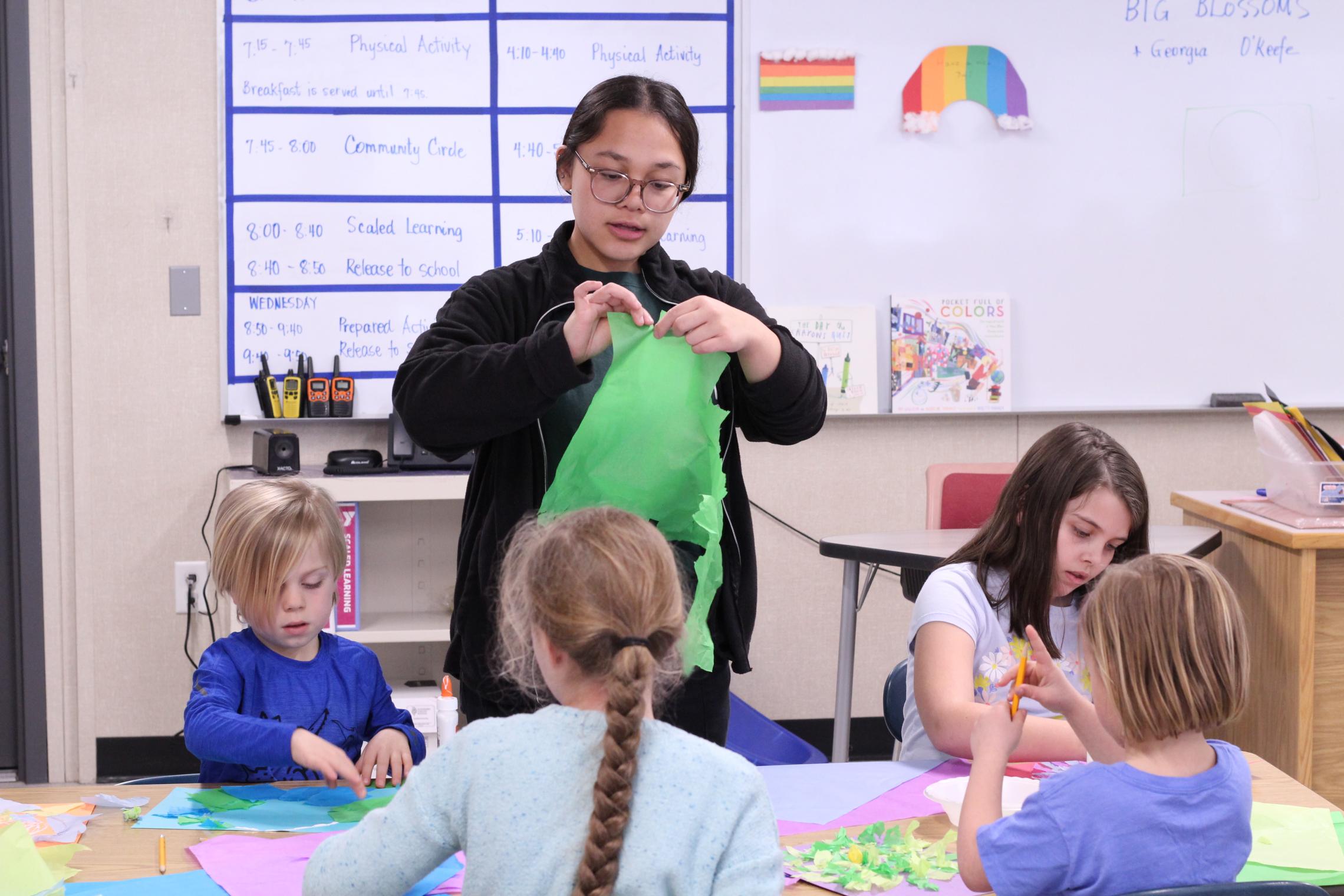 Marlena Site leader leading an art project to Harbor Heights Students