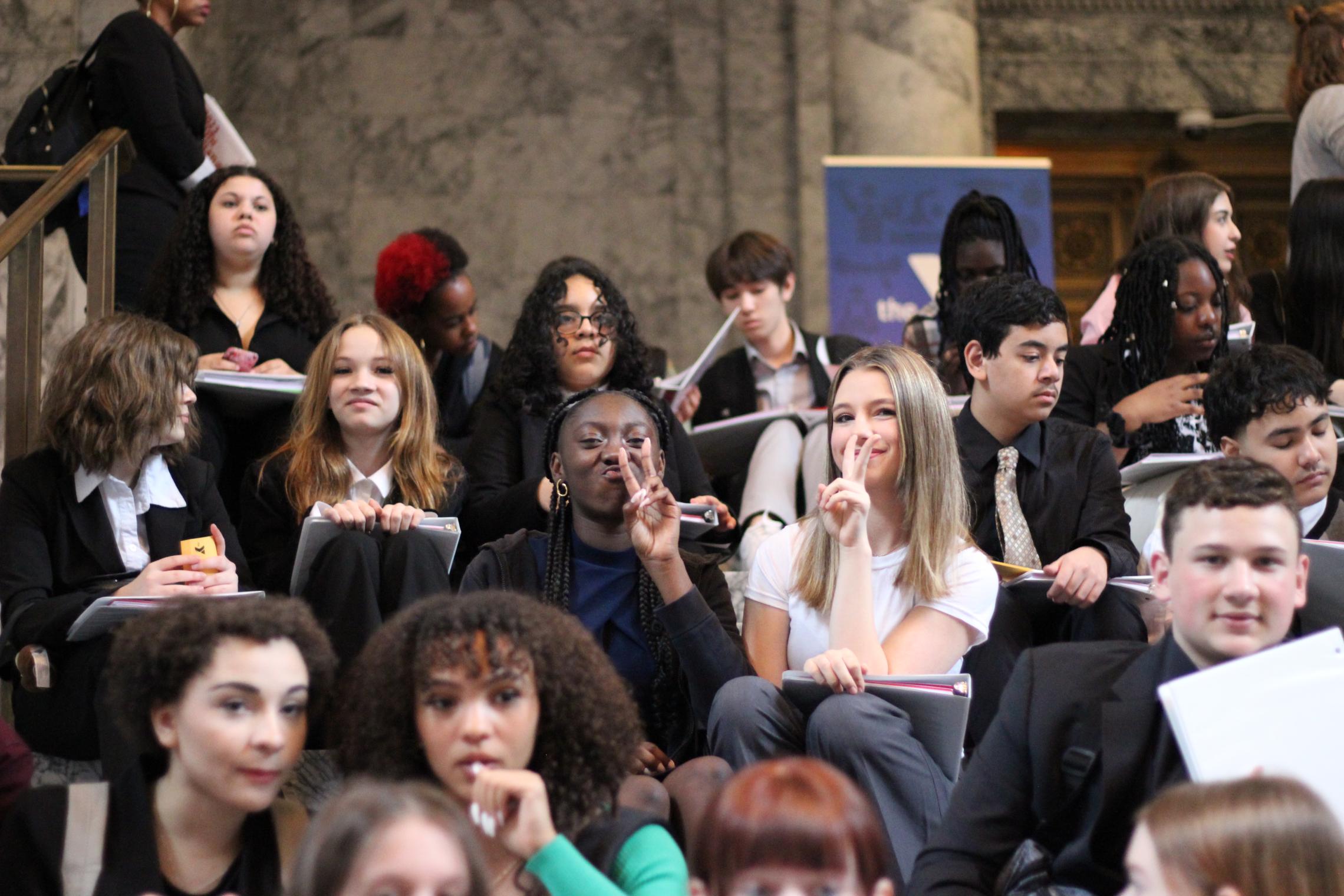 8th graders from the Ford Middle School Youth and Government program posing inside the State Capitol.  