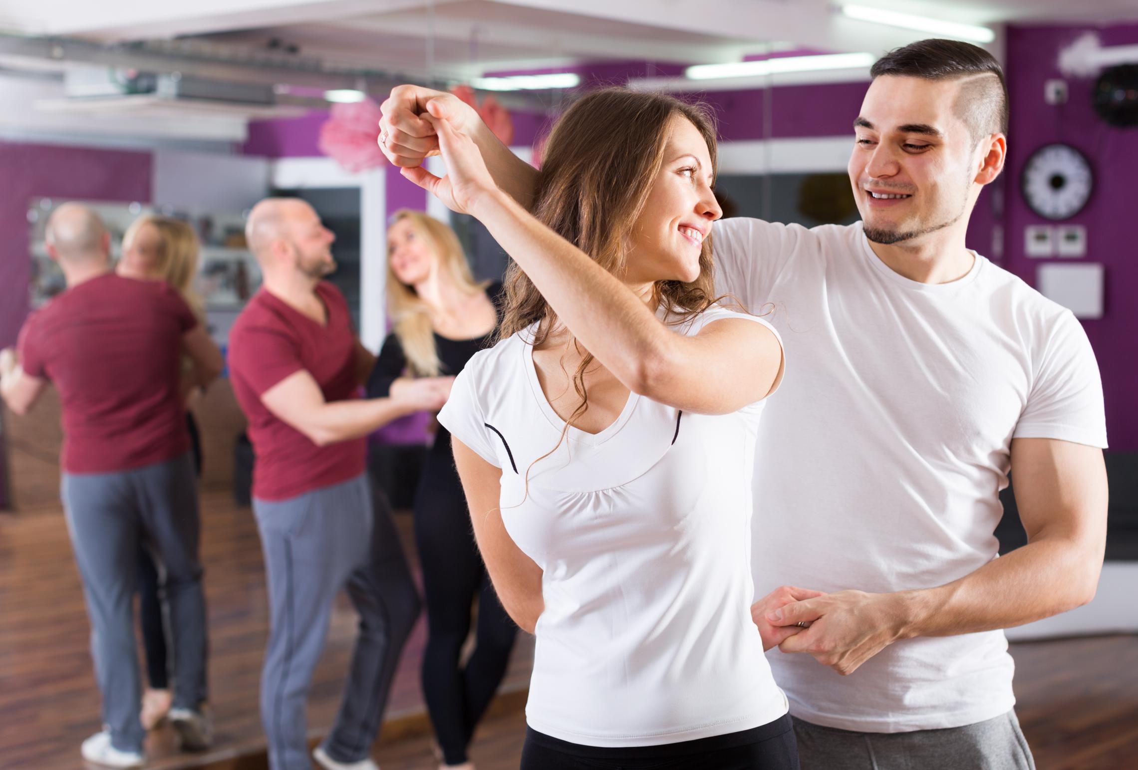 Dance partners in the middle of a spin move