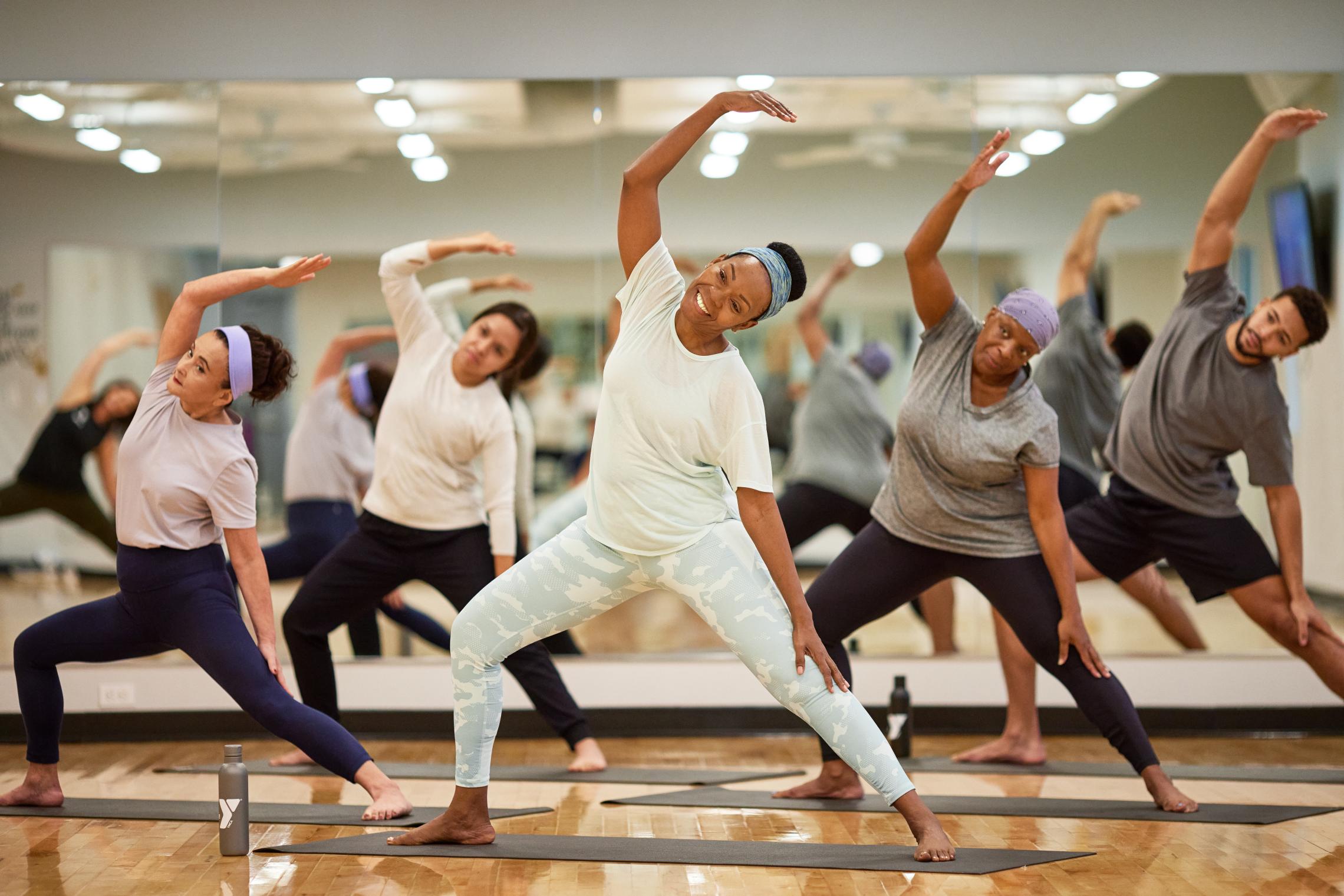 Vinyasa yoga group in the middle of a pose at the YMCA