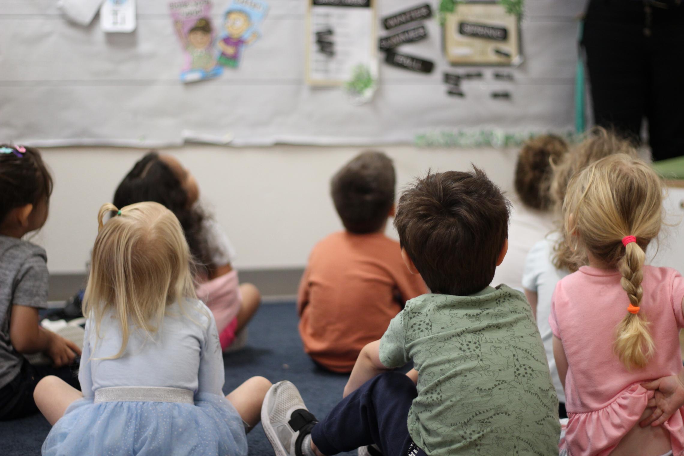 ELC students sit in attention for story time at the YMCA