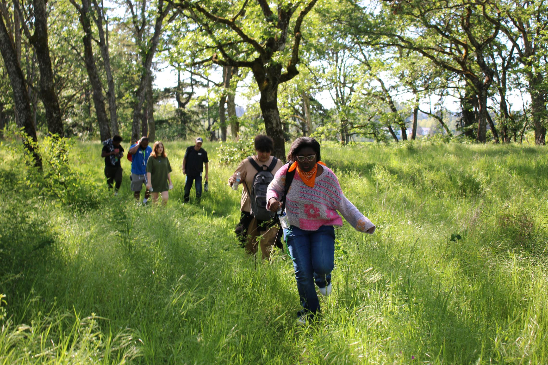 Community learning center students hike on a nature expedition at the YMCA