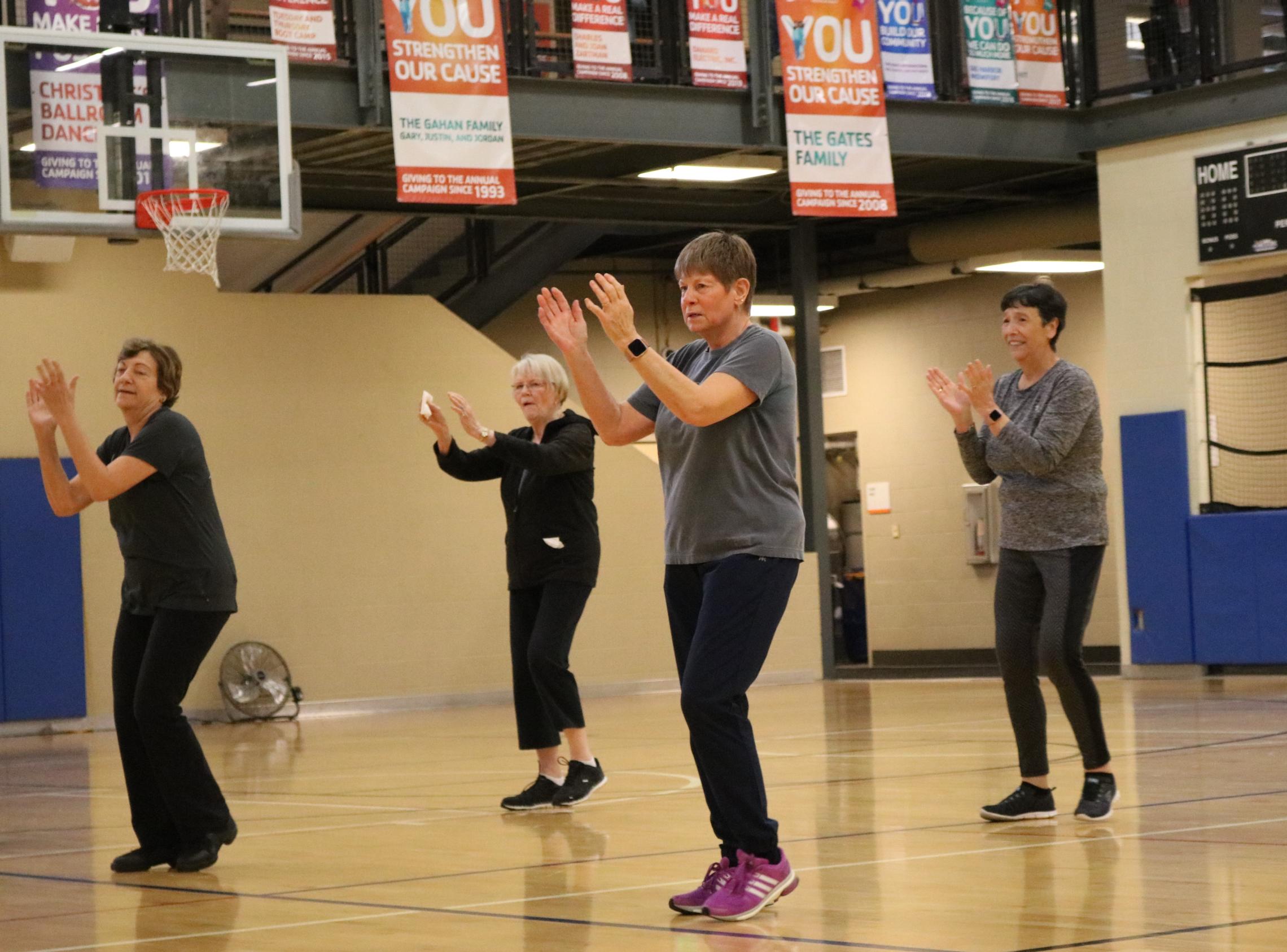 Action shot of a dance class being led at the YMCA