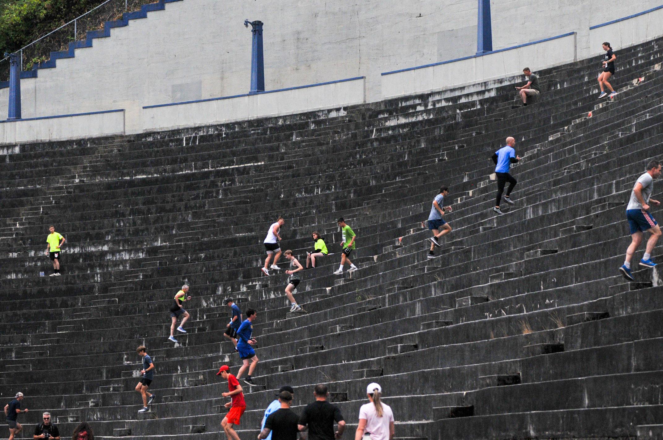 Unleashed participants run the steps at the Stadium High School football field