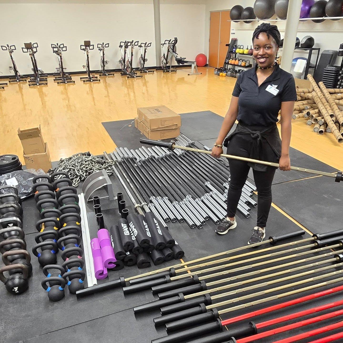 YMCA staff member assembling new sleds for their gym