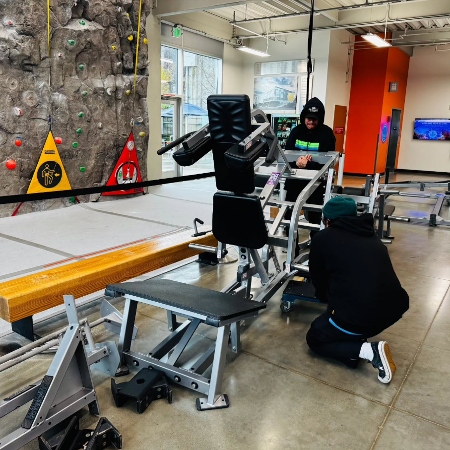 Staff work to move equipment at the YMCA in Tacoma