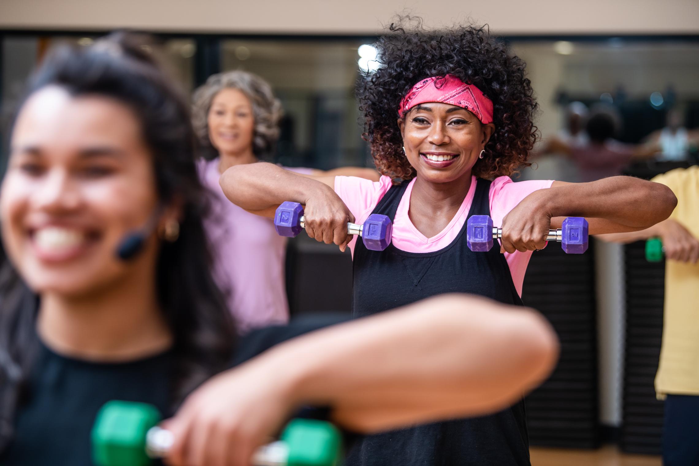 Action shot of a dumbell workshop at the YMCA