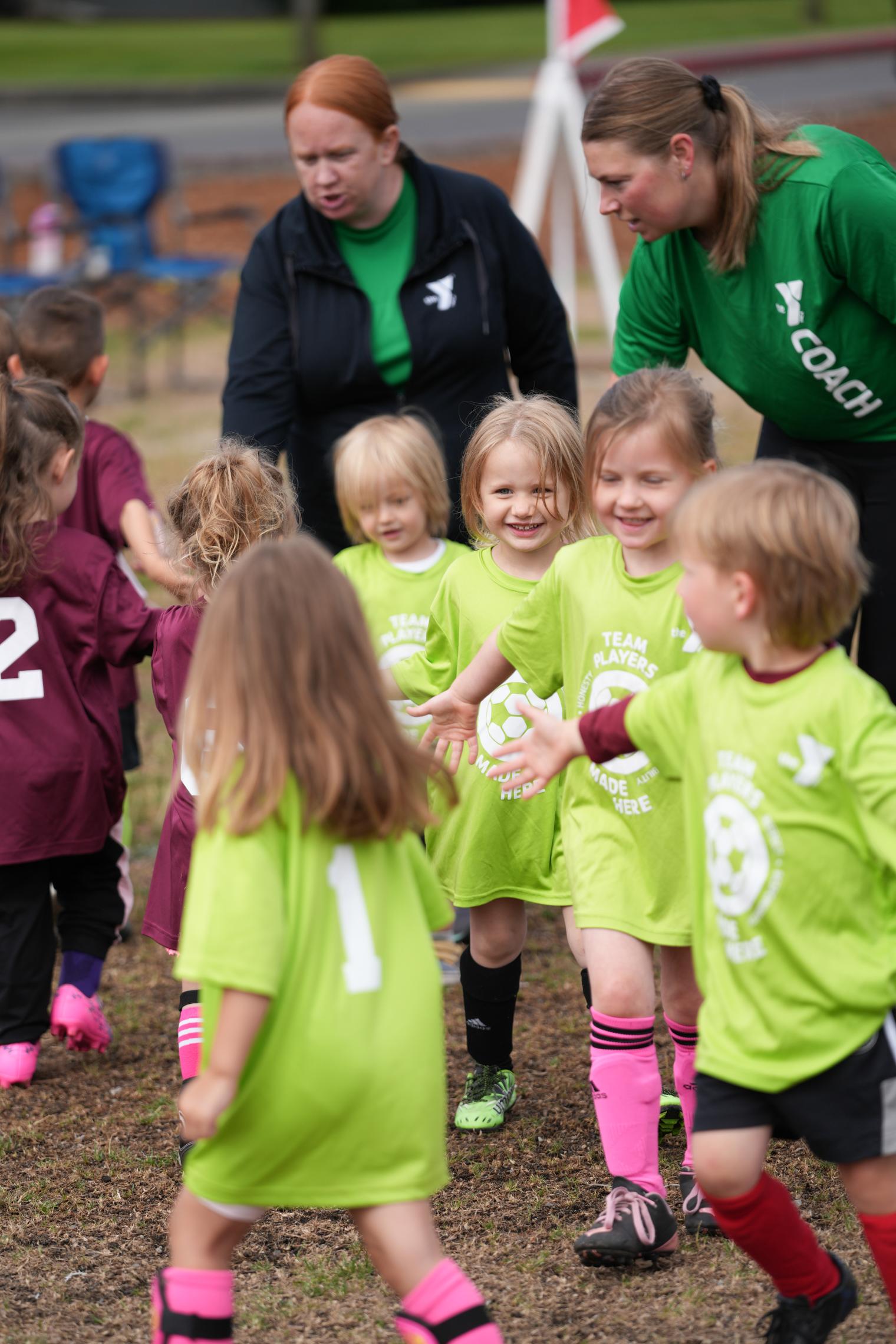 Hannah and another coach with their youth soccer team