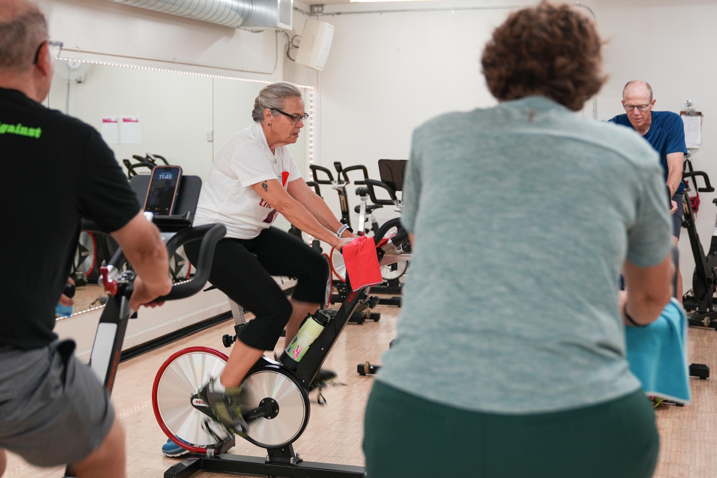 Action shot of a pedaling for Parkinson's class session at the YMCA