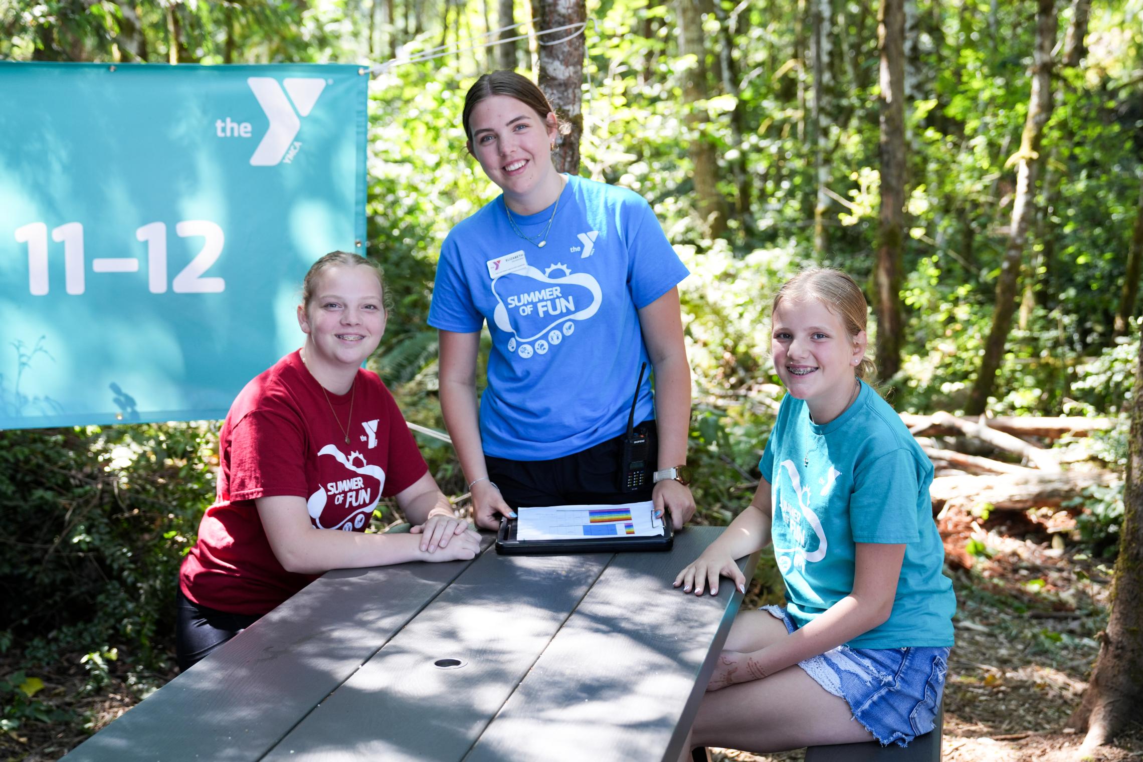 Three camp sisters at a table
