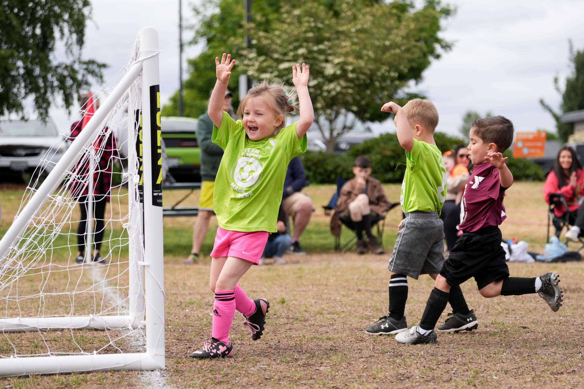 Youth Sports League participant scoring a goal