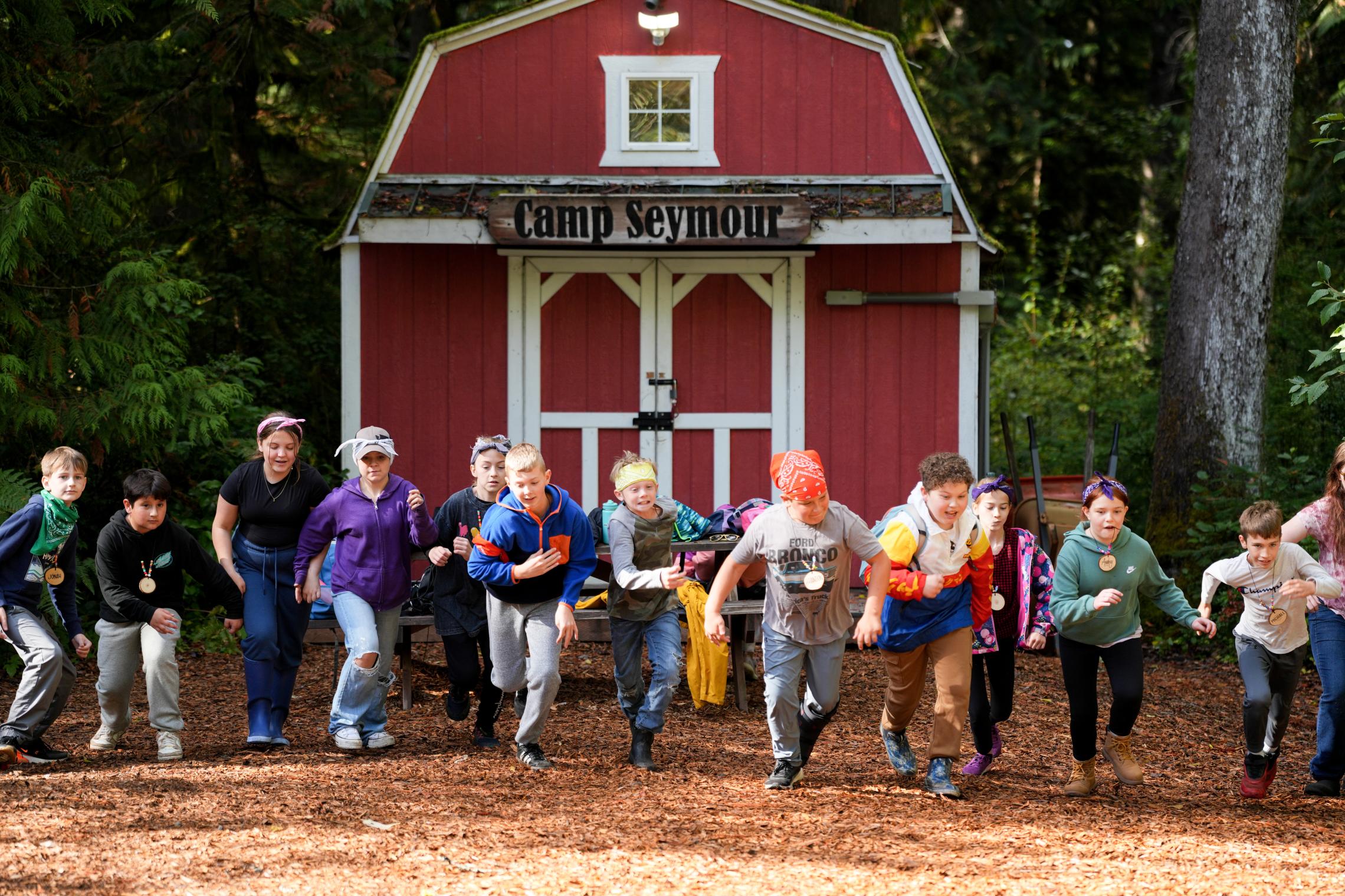 Campers run toward the camera