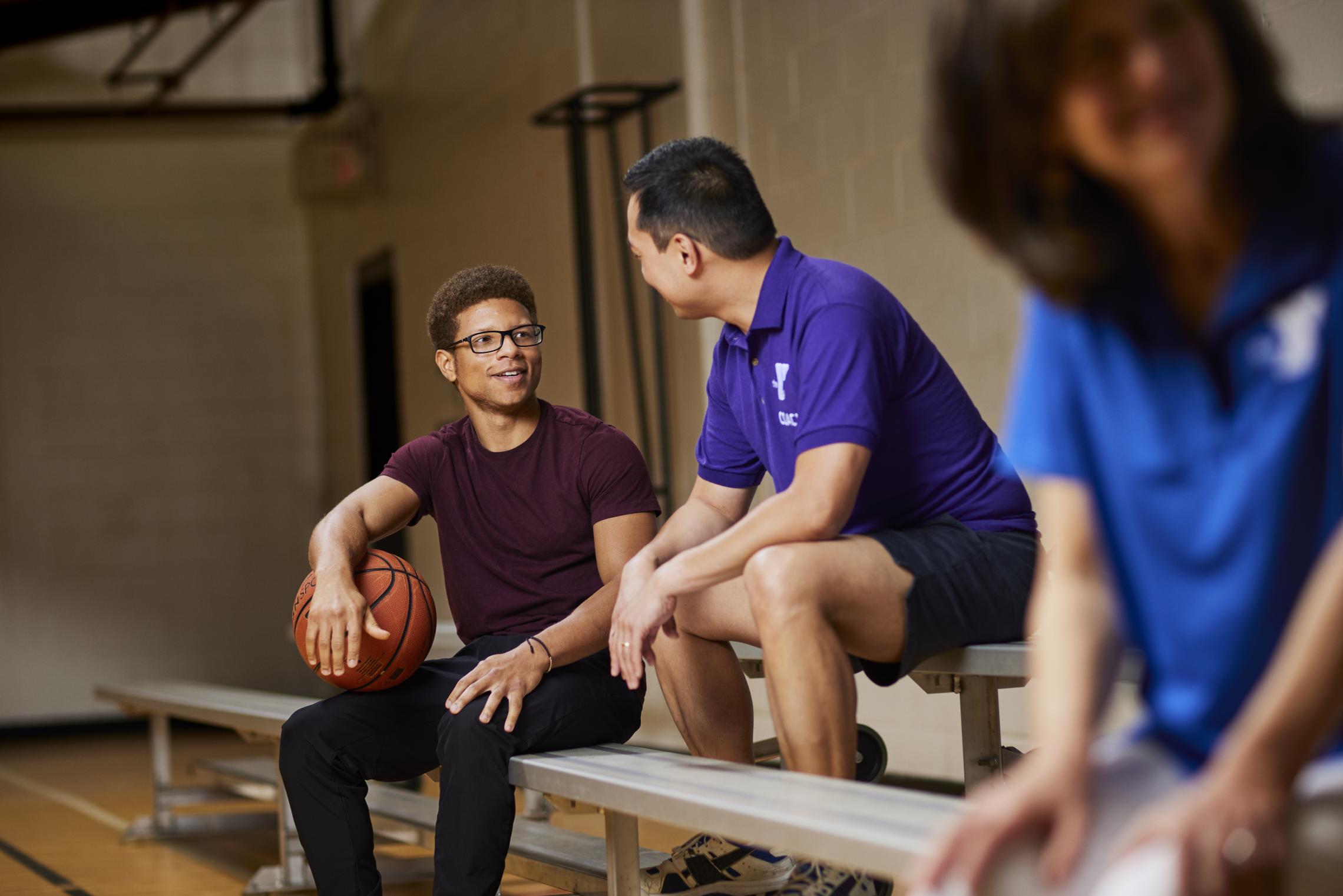 A YMCA Staff and Member in conversation