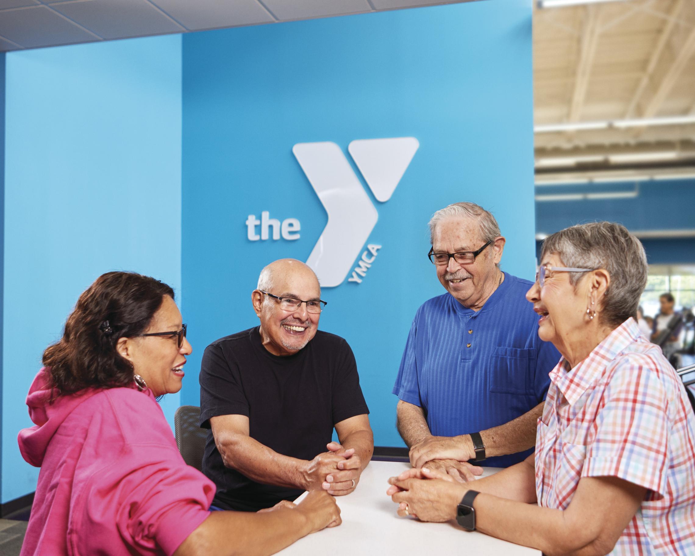 Staff and members at a YMCA front desk