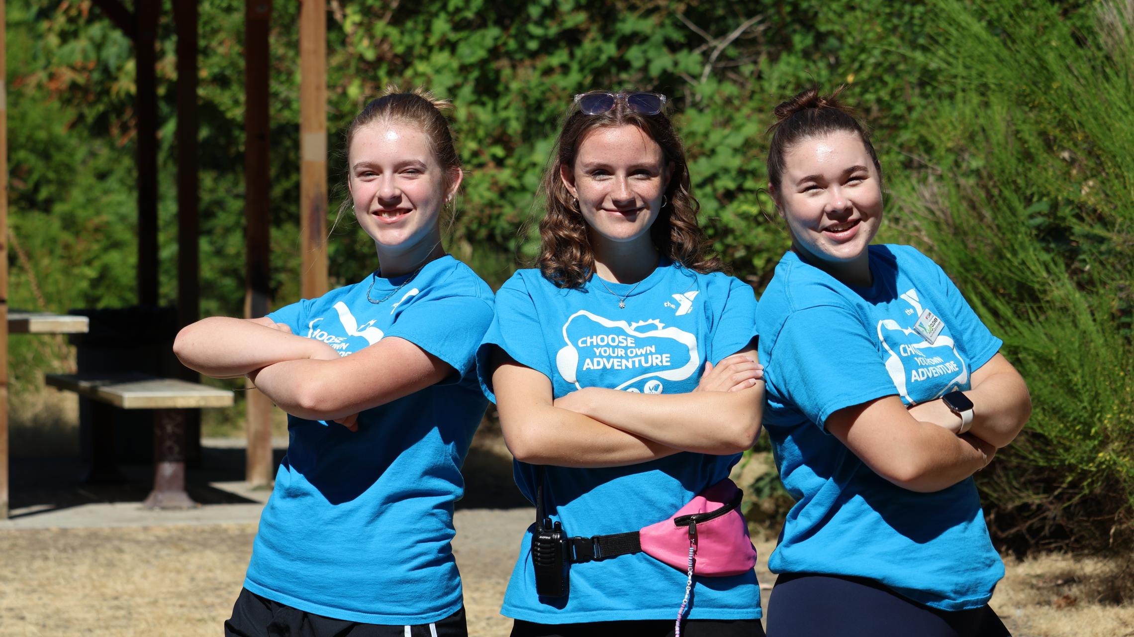 YMCA Summer Day Camp staff standing outdoors in Pierce and Kitsap Counties, promoting youth programs, outdoor activities, leadership development, and summer adventures.