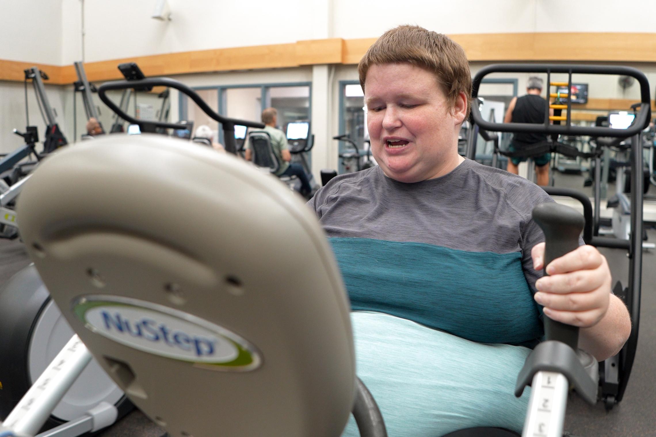 Annee Applegate uses a cardio machine at the YMCA as part of a health journey focused on increased physical activity and diabetes prevention.