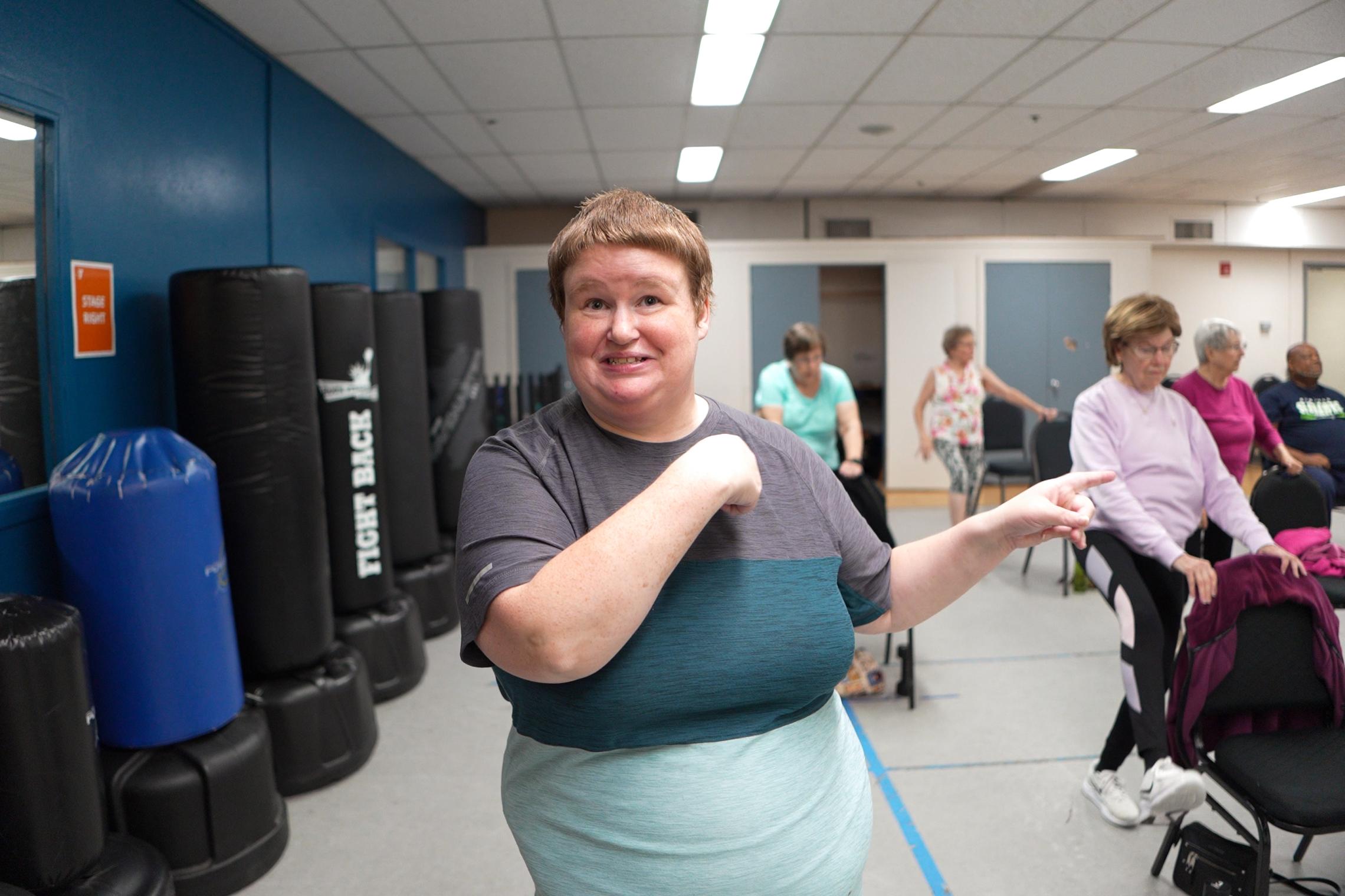 Annee Applegate participates in a YMCA group fitness class, demonstrating the supportive community and healthy lifestyle habits encouraged through YMCA wellness and diabetes prevention programs.